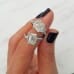 2.63ct Emerald Cut Diamond Three-Stone Engagement Ring finger