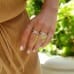 4.23 Carat Pear Shape Yellow Diamond Two-Tone Engagement Ring hand