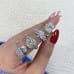 1.55 carat Round Lab Diamond Graduating Floral Engagement Ring finger