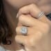 5.08ct Emerald Cut Lab Diamond Three-Stone Engagement Ring hand