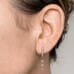 Round Diamond Dangle Earrings on ladies ear
