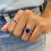 Sapphire and Diamond Shared Prong Eternity Band fist