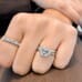 1.80 ct Emerald Cut Diamond Three-Stone Ring on ladies hand white gold
