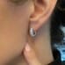 Wide Diamond Huggie Earrings ear