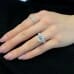 4.08 carat Emerald Lab Diamond Three Stone Engagement Ring hand