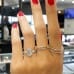 2.63 carat Emerald Cut Diamond Three-Stone Engagement Ring hand