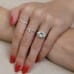 4.01 carat Cushion Cut Three-Stone Engagement Ring hand